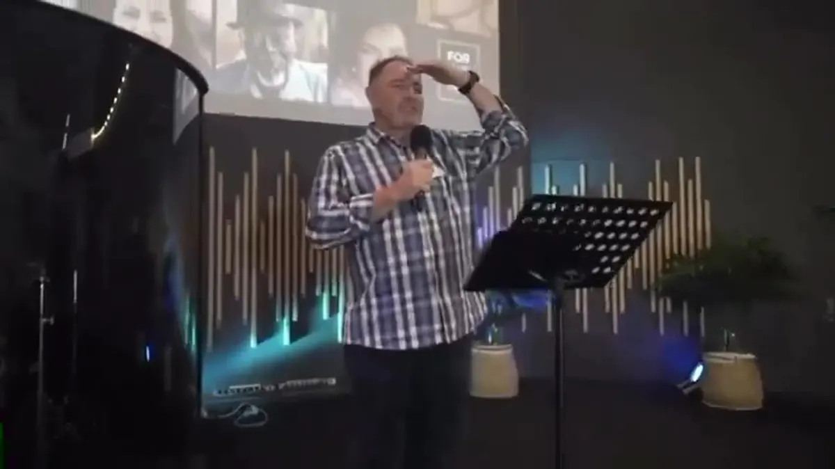 A speaker on stage at the men's event