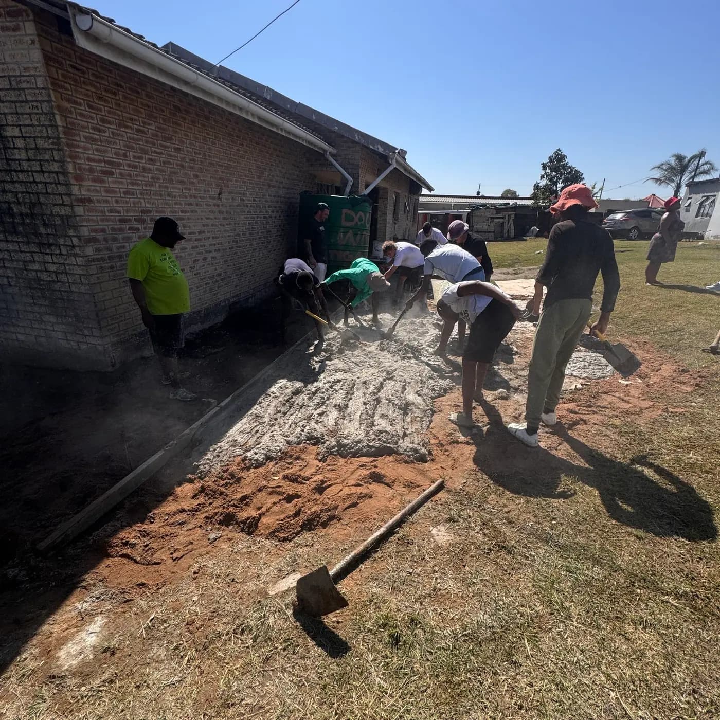 Mixing and barrowing concrete for the new slab