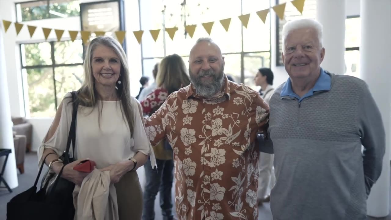Three friends together in the church foyer